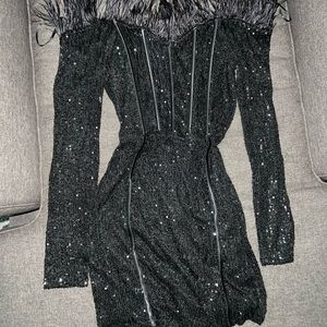 Black dress size L - has a lot of stretch can be up to XL with no problems.